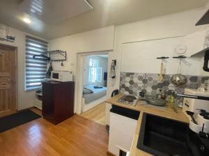 a kitchen with a sink and a counter top at Kantreküla Apartment - lemmikloomasõbralik ja kodune in Viljandi +10 photos