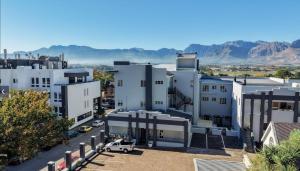 an aerial view of a city with mountains in the background at The Lazy Expat - Paarl - Self Catering Apartment in Paarl