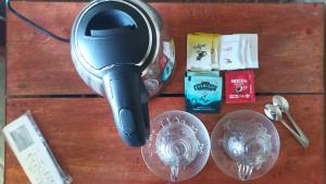 a hair dryer sitting on top of a wooden table at Trekker's Lodge in Matale
