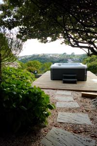 a television sitting on top of a wooden deck at Alto Paraíso Boutique Hotel in Reguengo Grande