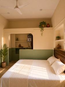 a bedroom with a large bed in a room at Shristays in Varanasi