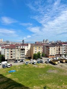 a parking lot with parked cars in a city at Classic Suite MK1 in Istanbul
