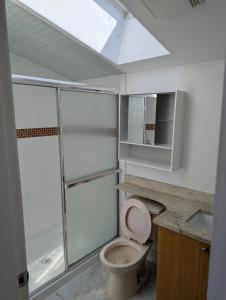 a bathroom with a toilet and a shower and a sink at Private Room in Guest House, Near the New Oakridge Mall & Transit - Near Langara 49th Station in Vancouver
