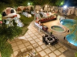 an overhead view of a pool with a table and chairs at Karnak Hotel Luxor in Luxor +13 photos