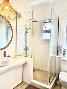 a bathroom with a shower and a sink at Little Palm Penthouse in Cap Malheureux +19 photos