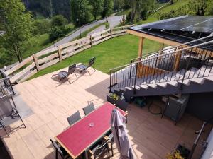 an overhead view of a patio with a table and chairs at MOUNTAIN DELUXE 27 APARTMENTS con WELLNESS in Cavalese +38 photos