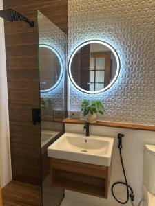 a bathroom with a sink and a mirror at Beas Boutique House Khlong Dow in Ko Lanta +48 photos
