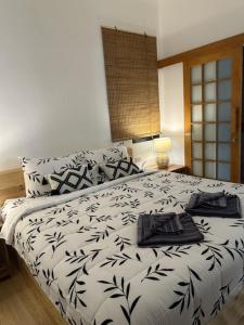 a bedroom with a bed with a laptop on it at Beas Boutique House Khlong Dow in Ko Lanta