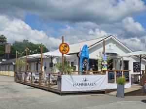 a building with a sign that reads harlemken at Malenasro in Karlshamn