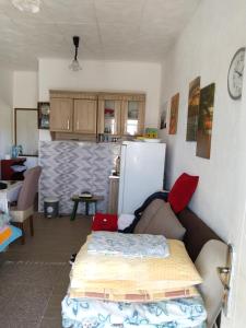 a living room with a couch and a kitchen at Ogi in Straševina
