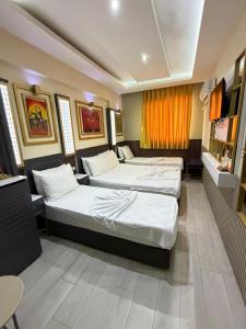 a hotel room with two beds in it at Exporoyal Hotel in Antalya