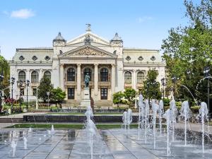a building with a fountain in front of a building at Konstanzer Q - City Studio - Palas Mall - AC in Iaşi