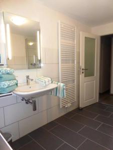 a bathroom with a sink and a mirror at Philippsburg in Monreal
