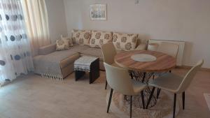 a living room with a couch and a table at Apartment Panorama in Kotor