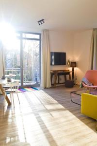 TV a/nebo společenská místnost v ubytování Appartements Villa Schwanenteich