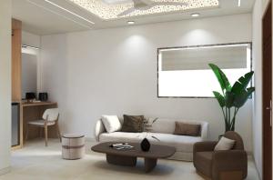 a living room with a couch and a table at Taj Inn Hotel in Agra