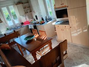 a kitchen with a table and a dining room at Casa Adelina in Foz