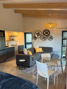 a living room with a couch and a table at The Sleep Studio in Kampersrus AH