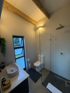 a bathroom with a toilet and a glass shower at The Sleep Studio in Kampersrus AH +9 photos