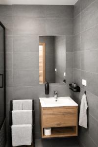 a bathroom with a sink and a mirror at Na kopečku u lesa in Březová +13 photos