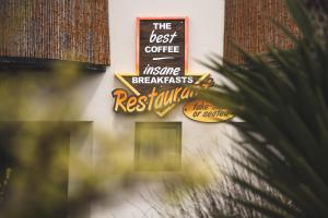 a sign on the side of a restaurant at 3 Pepper Street by African Perfection in Jeffreys Bay