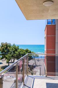a balcony with a view of the beach at Hotel Maresol Accommodation in Shëngjin