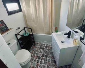 a bathroom with a toilet and a sink at Casa Urgueira in Pendilhe +25 photos