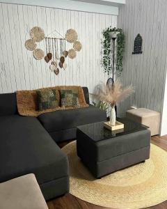 a living room with a couch and a coffee table at Mi Casa in Tagaytay