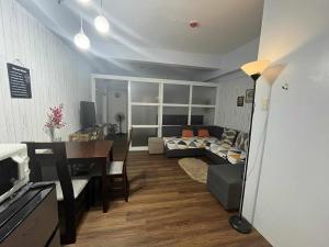a living room with a couch and a table at Mi Casa in Tagaytay