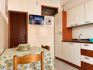 a kitchen with a table with a bowl on it at Vista Isole Eolie in Piraino