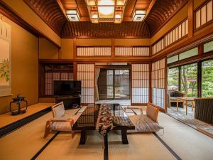 a living room with a table and chairs at Haiya in Awara