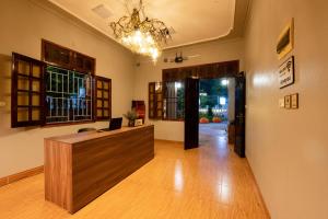 an office with a desk with a laptop on it at Tada Moc Chau - Villa & Local Kitchen in Mộc Châu