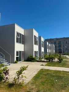 a row of buildings in a city at South Harbour Studios in Vordingborg