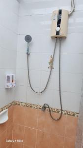 a shower in a bathroom with a shower at Chaya village B - a shared pool & Jacuzi in Ko Lanta +25 photos