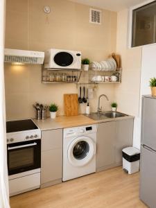 a kitchen with a washing machine and a sink at LG53 Tour & Hostel in Ulaanbaatar