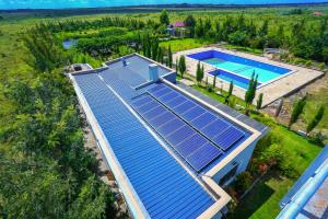 an overhead view of a house with solar panels on the roof at Bella Pollito in Nairobi