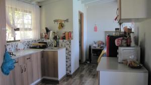 a kitchen with a sink and a counter top at The Little Cove in Vaal Marina