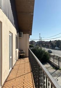 a balcony of a building with a wooden deck at Casa Silvia in Costinesti