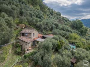 an aerial view of a house on a mountain at Tuscan house, exclusive pool, private garden in Bagni di Lucca