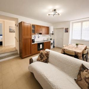 a living room with a couch and a table at Tra i laghi lago maggiore e lago d'orta in Invorio Inferiore