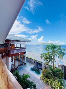 a house on the beach with a view of the ocean at La Vue De Mer in La Digue