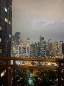 a view of a city skyline at night at 45ft Floor with Fast Wi-Fi Pool & Gym Access in Manila