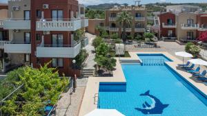 an aerial view of a hotel with a swimming pool at Ekavi Apartments in Agia Marina Nea Kydonias +7 photos