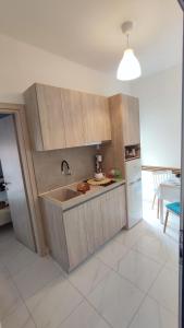 a kitchen with a sink and a counter top at Little Hause in Psakoudia