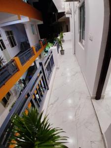 an overhead view of a hallway in a building with plants at Hotel Pantao Rishekesh in Rishīkesh