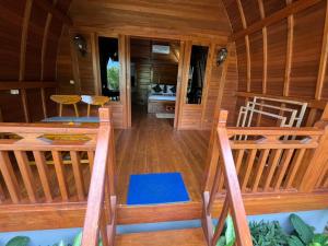 an inside view of a cabin with a wooden floor at Kawandini Homestay in Sidemen +15 photos