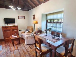 a living room with a table and a couch at Panchita in Garafía