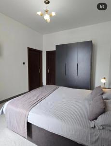 a bedroom with a large bed and a ceiling at GUEST HOUSE "Rohat Lux" in Samarkand