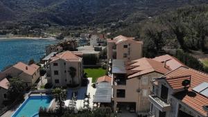 an aerial view of a house with a swimming pool at Bellezza Residence & Spa Kotor in Donji Morinj +219 photos