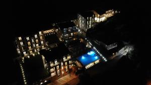 an overhead view of a building with lights at night at Bellezza Residence & Spa Kotor in Donji Morinj